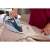 Woman using Philips Azur 7000 Series steam iron