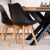 Mercaton black Scandinavian dining chairs around a dining table