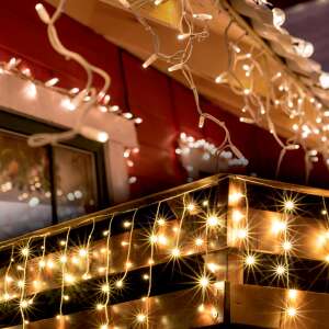 SOMOGYI warm white LED icicle lights decorating a house for Christmas - Home by Somogyi String Light