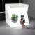 Light Room Photo Box with LED lighting, white foldable studio for product photography, example of use with plant