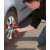 Man using Einhell TE-CW 18 Li BL-Solo cordless impact wrench to change a car tire