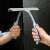 Woman using York Bacteria Stop window squeegee to clean a shower door