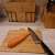Bamboo cutting board with a carrot and a knife, perfect for preparing vegetables