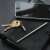 True Utility TELEPEN telescopic pen with keychain, keys and smartphone on a leather notebook
