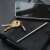 True Utility TELEPEN telescopic pen with keychain, keys and smartphone on a leather notebook