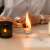Burning tea light candle, romantic atmosphere