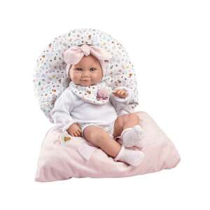 Llorens 38cm newborn baby doll with pink sleeping bag, wearing a white onesie, a pink headband, and a bib, sitting on a pink pillow with a floral pattern - LLorens