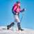 Woman hiking in snow with Trizand crampons for shoes