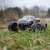 2WD Spirit RC Monster Truck on grass, outdoor action shot