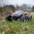 2WD Spirit RC Monster Truck on grass, outdoor action shot