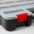 Close-up of the red latch on the stackable organizer box