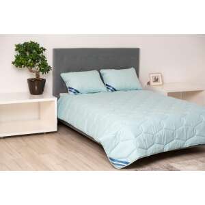 Somnart Bella cotton duvet 180x200cm, medium thickness summer filling, blue, on a bed with pillows - Duvet