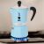 Bialetti Rainbow light blue stovetop espresso maker on a gas stove