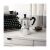 Bialetti Moka Express in aesthetic setting with coffee cup and typewriter