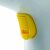 Close-up of Ariete 4167 handheld garment steamer yellow button