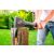 Man splitting wood with Verto axe, outdoor setting