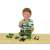 Child playing with John Deere tractor with front loader and weight, 1:24 scale, green and yellow toy tractor