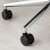 Close-up of Kwmobile office chair casters on a chrome base