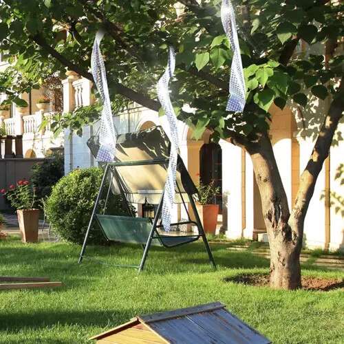 Bird scarer tape in use, Repest, garden, trees, protection