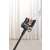 Dreame R10 Pro cordless stick vacuum cleaner, black, being used in a home