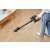 Woman using Dreame R10 Pro cordless stick vacuum cleaner, black, on hardwood floor