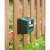 Nature ultrasonic animal repellent with connector, side view, mounted on a wooden fence