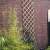 Nature 100x200 cm bamboo trellis, natural color, diamond pattern, for climbing plants, mounted on a brick wall