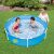 Children playing in Maxy metal frame pool in garden