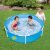 Children playing in Maxy metal frame pool in garden