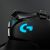 Close-up of Logitech G502 Lightsync RGB Gaming Mouse with illuminated G logo