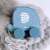 VIGA blue elephant pull-along toy on a fuzzy surface