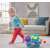 Child pulling Fisher-Price Poppin' Triceratops at home