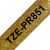 Close-up of Brother TZe-PR851 gold glitter label tape with black text