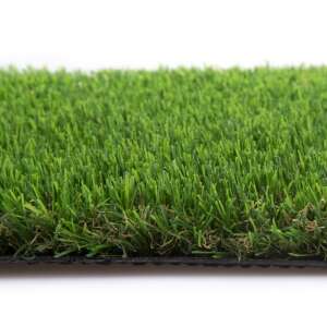 Close-up of the side of a green artificial grass rug, showing the texture and the black backing - Outdoor Flooring
