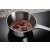 Electrolux LIB60420CK induction hob with a pot of melting chocolate