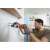 Man using Black+Decker BEHS02K-QS 800W SDS+ Rotary Hammer Drill to drill into a wall