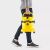 Man carrying Karcher WD 2 PLUS V-12/4/18 wet and dry vacuum cleaner
