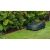 Bosch Indego S 500 robot lawn mower cutting grass near a flower bed
