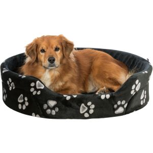 Câine fericit relaxându-se într-un pat pentru câini Trixie Jimmy din pluș - Paturi pentru câini