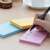 Writing on Stick'n adhesive note pad, yellow, blue, pink