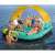 Bestway Sunny Lounge 5-person inflatable island with canopy, turquoise and yellow, people relaxing on it