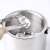 Stainless steel ice bucket with lid, ice tongs, spoon, and strainer