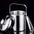 Stainless steel ice bucket with lid, ice tongs, spoon, and strainer