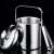 Stainless steel ice bucket with lid, ice tongs, spoon, and strainer