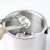 Stainless steel ice bucket with lid, ice tongs, spoon, and strainer