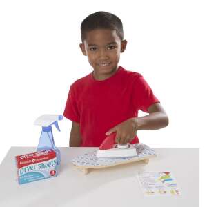 Melissa & Doug Laundry Basket Play Set, a child is ironing with a toy iron and ironing board - Melissa & Doug