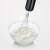 Severin SM3772 stick blender whisk attachment in use, whipping cream in a bowl