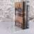 Clear acrylic bookend holding a vintage book