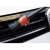 Xtrobb detailing brush for car cleaning, black and red, used on car grille
