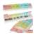7-day pill organizer with color-coded compartments, open and closed, with pills